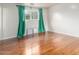Hardwood floors and natural light define this relaxing bedroom at 100 E Geneva Dr, Tempe, AZ 85282