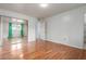 This bedroom features hardwood floors, ensuite bath and mirrored closet at 100 E Geneva Dr, Tempe, AZ 85282
