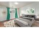 Cozy bedroom with a stylish bed, bedside tables, and eye-catching wall decor for a modern look at 100 E Geneva Dr, Tempe, AZ 85282