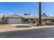 Single-story home with attached garage, desert landscaping, and a quaint, welcoming facade at 100 E Geneva Dr, Tempe, AZ 85282