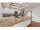 Well-lit kitchen boasts granite counters, stainless appliances and lots of storage at 100 E Geneva Dr, Tempe, AZ 85282