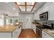 Eat-in kitchen with granite counters and stainless appliances at 100 E Geneva Dr, Tempe, AZ 85282