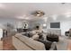 Open-concept living and dining area featuring a fireplace, ceiling fan, and seamless flow for entertaining at 100 E Geneva Dr, Tempe, AZ 85282
