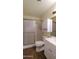Bathroom showcasing a shower with glass door, toilet, sink, and vanity at 1033 S Florence Dr, Mesa, AZ 85208