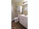 Bright bathroom with white vanity, mirror, and shower with glass doors at 1033 S Florence Dr, Mesa, AZ 85208