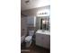 Bathroom with tub and shower combo, white vanity, and large mirror at 1033 S Florence Dr, Mesa, AZ 85208