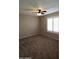 Cozy bedroom featuring neutral carpet and a window with shutters at 1033 S Florence Dr, Mesa, AZ 85208