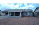Charming single-story home featuring a covered front porch and low-maintenance rock landscaping at 1033 S Florence Dr, Mesa, AZ 85208
