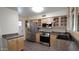 Nicely appointed kitchen offers stainless steel appliances, plenty of cabinet space, and granite countertops at 1033 S Florence Dr, Mesa, AZ 85208