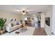 Bright open-plan living room featuring a comfortable seating area and seamless flow to the kitchen space at 1033 S Florence Dr, Mesa, AZ 85208