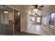 Living space features sliding glass doors, tile flooring, and ceiling fan at 1033 S Florence Dr, Mesa, AZ 85208