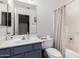 Bathroom featuring a vanity with storage, a large mirror, and a shower-tub combination at 10752 W Rio Vista Ln, Avondale, AZ 85323