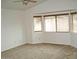 Spacious bedroom with carpet floors and multiple windows providing natural light at 10752 W Rio Vista Ln, Avondale, AZ 85323