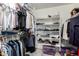 Walk-in closet featuring built in shelving and racks to maximize storage and organization at 10752 W Rio Vista Ln, Avondale, AZ 85323