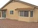 Back of a well-maintained single-story home with a desert landscape at 10752 W Rio Vista Ln, Avondale, AZ 85323