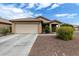 Charming single-story home with a well-maintained front yard, two car garage, and neutral color scheme at 10752 W Rio Vista Ln, Avondale, AZ 85323