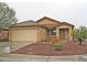Charming single-story home with a well-maintained front yard and covered entry way at 10752 W Rio Vista Ln, Avondale, AZ 85323