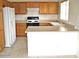 Efficient kitchen with wood cabinets, laminate countertops and modern appliances at 10752 W Rio Vista Ln, Avondale, AZ 85323