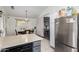 Kitchen with views of dining room, open concept, and stainless-steel fridge at 10752 W Rio Vista Ln, Avondale, AZ 85323