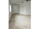 Bright living room featuring vaulted ceilings, carpet floors, and a closet at 10752 W Rio Vista Ln, Avondale, AZ 85323