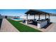 Lush backyard with outdoor seating, entertainment area, pool, mountain views, and privacy for relaxation at 10910 N Thunderbird Rd, Maricopa, AZ 85139
