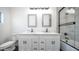 Bright bathroom with double vanity, quartz countertop and sleek, modern fixtures at 10910 N Thunderbird Rd, Maricopa, AZ 85139