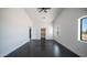 Large empty bedroom featuring large windows and two closets for storage at 10910 N Thunderbird Rd, Maricopa, AZ 85139