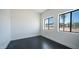 Bright bedroom with two windows providing ample natural light and a view of the outdoors at 10910 N Thunderbird Rd, Maricopa, AZ 85139