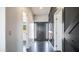 Hallway view with dark gray doors, light colored walls and dark polished floor at 10910 N Thunderbird Rd, Maricopa, AZ 85139