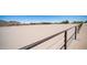 Large outdoor horse arena with well-maintained sand, providing ample space for training and equestrian activities at 10910 N Thunderbird Rd, Maricopa, AZ 85139