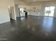 Open-concept kitchen with white cabinets, stainless steel appliances, and ample countertop space at 10910 N Thunderbird Rd, Maricopa, AZ 85139