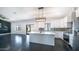 Sleek and modern kitchen with stainless steel appliances, white cabinetry, and stylish backsplash creating a culinary haven at 10910 N Thunderbird Rd, Maricopa, AZ 85139