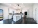 Stylish kitchen with a central island, stainless steel appliances, modern cabinets, and trendy lighting at 10910 N Thunderbird Rd, Maricopa, AZ 85139