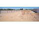 Wide view of a large, flat piece of land with fencing, ideal for various outdoor activities or development projects at 10910 N Thunderbird Rd, Maricopa, AZ 85139