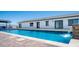 Inviting pool showcasing clean water, a modern design, and a view of the home's exterior, creating a perfect retreat at 10910 N Thunderbird Rd, Maricopa, AZ 85139
