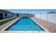 Gorgeous swimming pool with travertine and brickwork offers a backyard oasis, perfect for relaxation at 10910 N Thunderbird Rd, Maricopa, AZ 85139