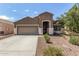 Charming single-story home featuring a two-car garage and low-maintenance desert landscaping at 12041 W Melinda Ln, Sun City, AZ 85373