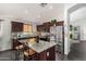 Modern kitchen with stainless steel appliances, granite countertops, and a stylish backsplash at 12041 W Melinda Ln, Sun City, AZ 85373