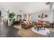 Spacious living room with a cozy seating area, perfect for relaxation and entertainment at 12041 W Melinda Ln, Sun City, AZ 85373