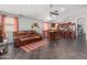 Spacious living area with view of kitchen/dining, perfect for Gathering meals and entertaining guests at 12041 W Melinda Ln, Sun City, AZ 85373