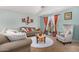 Inviting living room with comfortable seating and stylish decor, creating a warm atmosphere at 12041 W Melinda Ln, Sun City, AZ 85373