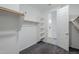 Walk-in closet with a doorway that looks into the bathroom, with carpet and rack storage at 12048 E Chevelon Trl, Gold Canyon, AZ 85118