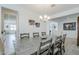 Open dining area with views of the kitchen and stylish pendant lighting at 12048 E Chevelon Trl, Gold Canyon, AZ 85118