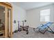 Well-equipped exercise room with gym equipment and great natural light at 12048 E Chevelon Trl, Gold Canyon, AZ 85118