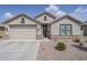 Charming single-story home with a two-car garage and low-maintenance desert landscaping at 12048 E Chevelon Trl, Gold Canyon, AZ 85118