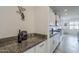 Kitchen featuring granite countertops, stainless steel appliances, and white cabinetry at 12048 E Chevelon Trl, Gold Canyon, AZ 85118
