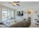 Cozy living room with tile flooring and sliding glass doors to the outdoor space at 12048 E Chevelon Trl, Gold Canyon, AZ 85118