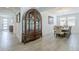 Open floor plan with decorative cabinet and dining area with plenty of natural light at 12048 E Chevelon Trl, Gold Canyon, AZ 85118