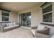 Outdoor patio with a neutral toned tile floor, stylish furniture, and a bright view at 12048 E Chevelon Trl, Gold Canyon, AZ 85118