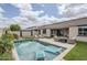 Resort-style pool with in-water lounge chairs, patio, and landscaped surroundings at 12048 E Chevelon Trl, Gold Canyon, AZ 85118